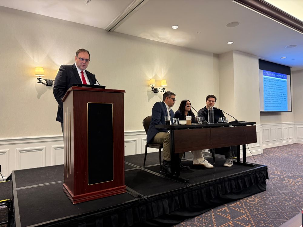 Speaker presenting at the SSP annual conference podium